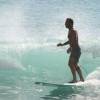 Renato surfing with Santa in the background@South Point Barbados 14.12.06 014