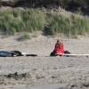 Lonely surfergirl on the beach @ Renesse's Northshore 423