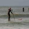 Arjen paddling out on his SUP board @ Vuurtorenpad Nieuw-Haamstede