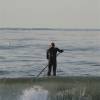 Arjen paddling out on his SUP board @ the Northshore of Renesse