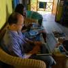 Rachman & Ianthe going through the pics @ Seascape Beach House Barbados