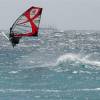 Arjen taking off  with a 5 mast cruiseship on the background@Surfers Point Barbados