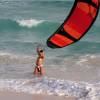 Kite help girl launching a kite @ Silver Sands Barbados