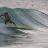 Kevin Talma sup on a steep wave @ South Point Barbados