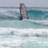 The Tushingham Rock in logo high waves @ Surfers Point