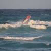 Tushingham Rock in logo high waves @ Ocean Spray Barbados