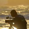 Filmer Nick Welch @ work in the sunset @ Surfers Point Barbados